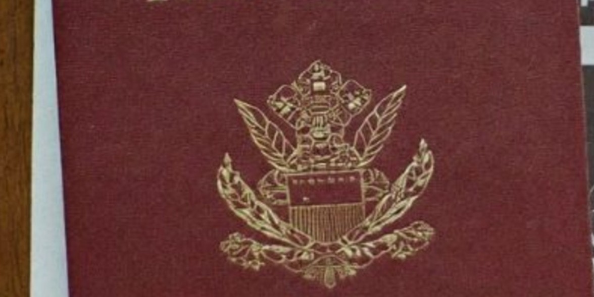 Passport and application documents on a desk